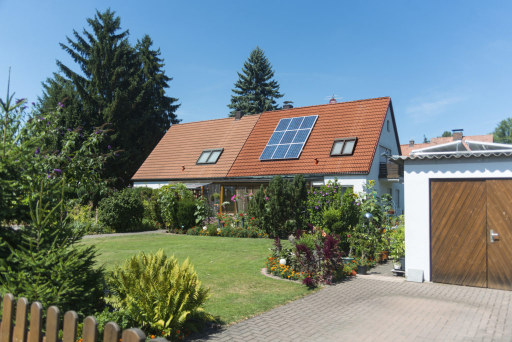 Nuremberg, Germany - July 26, 2015: house with solar panels. Blue sky and no person visible. house is standing in nuremberg east.